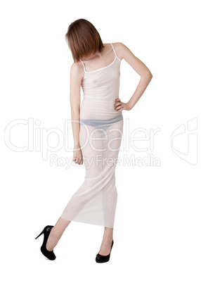 Slim woman posing in white translucent negligee