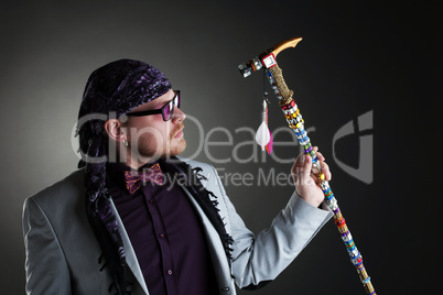 Shot of middle-aged man posing with decorated cane