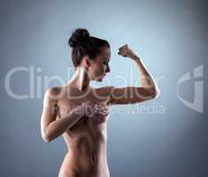 Image of sensual slim model posing nude in studio