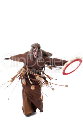 Shot of angry shaman dancing with tambourine