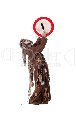 Middle-aged man posing as shaman in studio