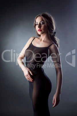 Beautiful naked girl posing in black negligee