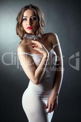 Portrait of sensual model in skin-tight negligee