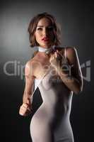 Beautiful nude model posing in tight negligee