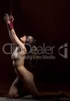 Shot of nude girl posing blindfold and bound