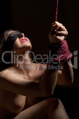 Portrait of beautiful girl with her hands tied