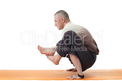 Image of yoga instructor posing in difficult asana