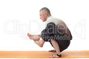 Image of yoga instructor posing in difficult asana