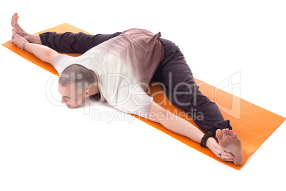 Shot of middle aged man practicing yoga on mat