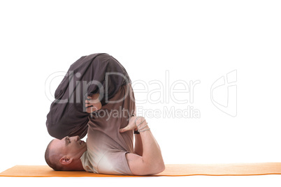 Yoga trainer posing in difficult asana