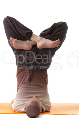 Image of flexible yogi posing in difficult pose