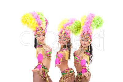 Trio of artistic samba dancers smiling at camera