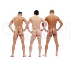 Three muscular naked men posing back to camera