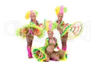 Energetic young girls dancing in carnival costumes