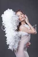 Image of beautiful woman posing with angel wings