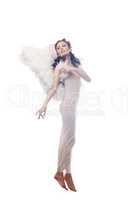 Charming curly brunette posing in angel costume