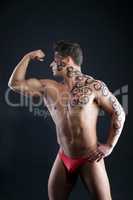 Image of muscular guy posing with pattern on body