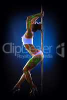 Shot of sexy flexible dancer posing with pylon