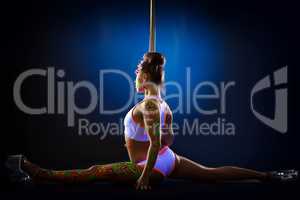 Flexible athletic dancer posing on splits