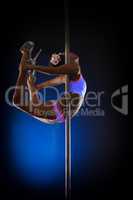 Image of seductive pole dancer posing in jump