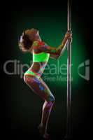 Image of sexy young woman posing with pole