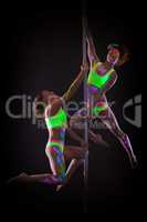 Amazing dancers posing with luminous neon makeup
