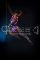 Image of sexy pole dancer posing in jump