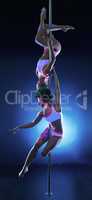Image of two elegant slim women dancing on pole