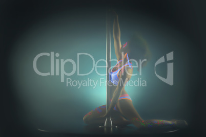Image of attractive pole dancer posing in smoke