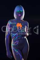 Alluring girl with neon makeup posing naked