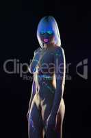 Nude skinny model posing with UV makeup
