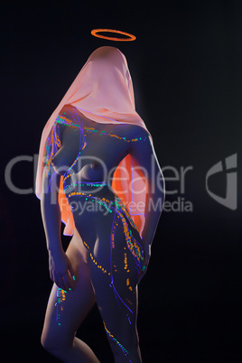 Sexy faceless girl posing with UV pattern on body