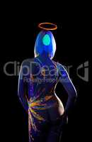 Girl with UV pattern on body posing back to camera