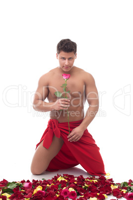 Smiling handsome man with rose posing at camera