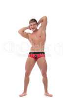 Cheerful muscular guy advertises underwear