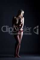 Kinbaku art - naked blonde posing tied with rope