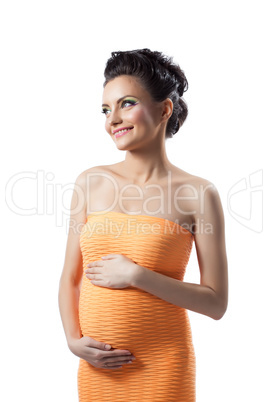 Studio shot of happy elegant expectant mother