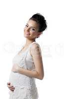 Happy pregnant woman posing looking at camera