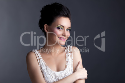 Image of smiling young model with evening make-up