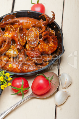 fresh seafoos stew on an iron skillet