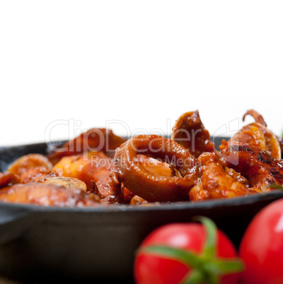 fresh seafoos stew on an iron skillet