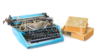 old typewriter and books isolated on white background