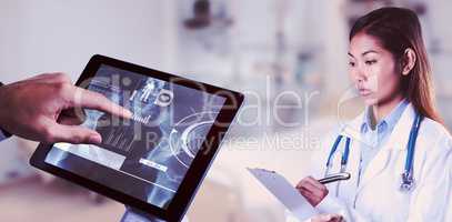 Composite image of asian doctor writing on files