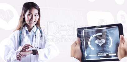 Composite image of asian doctor using her smart watch