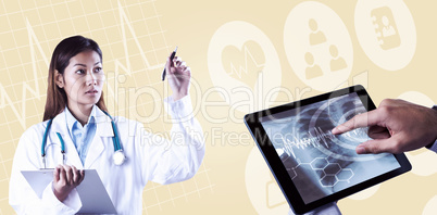 Composite image of asian doctor pointing with pen