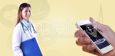 Composite image of asian doctor holding blue binder