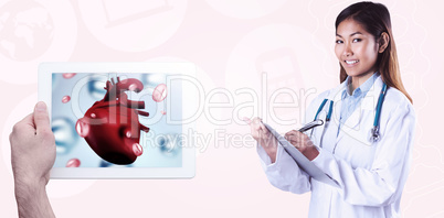 Composite image of asian doctor writing on files