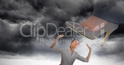 Composite image of businesswoman about to step on banana peel