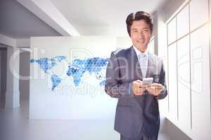 Composite image of confident estate agent standing at front door