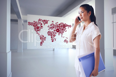 Composite image of casual businesswoman on the phone holding fol